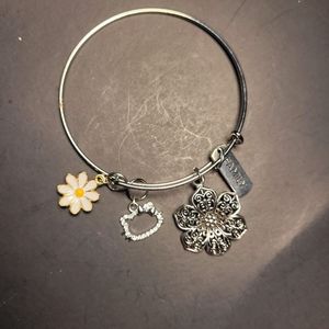 Bangle bracelet with charms
